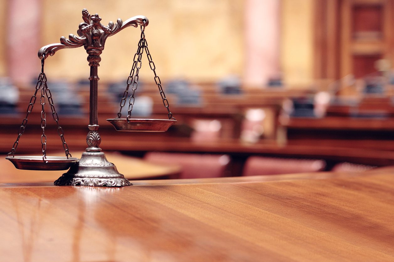 Symbol of legal balance in courtroom